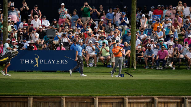 Rickie Fowler hits from the 17th hole in the 2023 Players Championship.